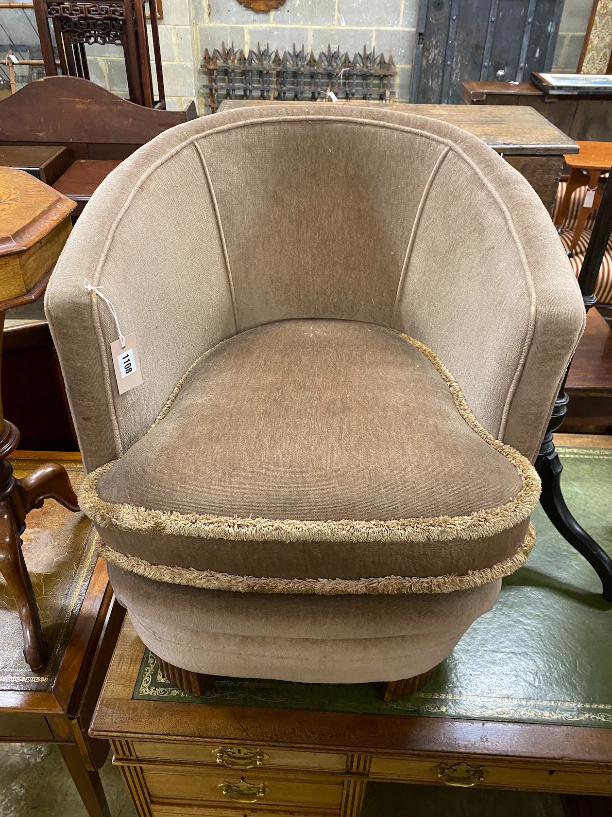 A late 19th century Flemish carved oak dining chair, a pole screen and an upholstered tub chair